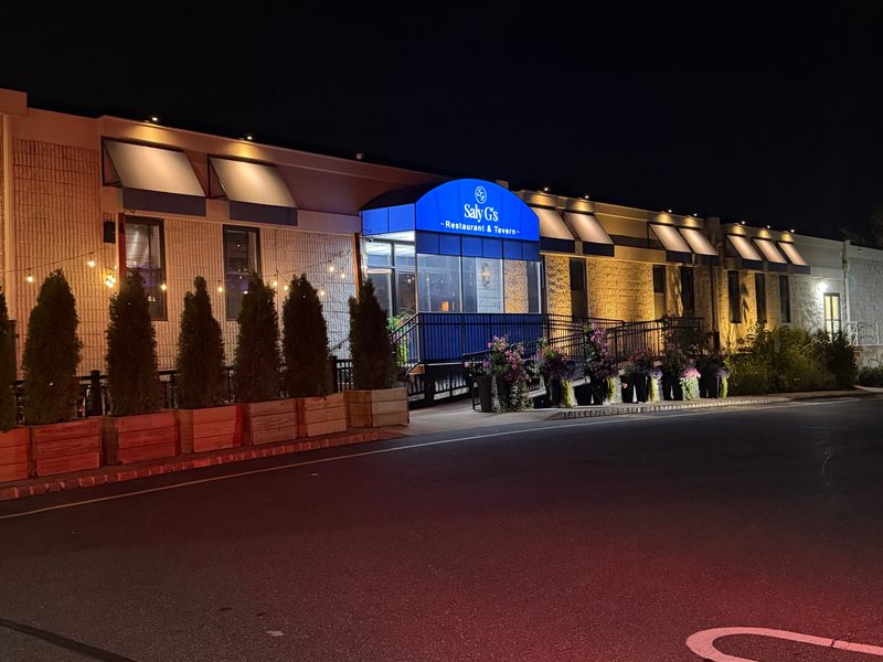 Saly G's Restaurant & Tavern awnings lit at night